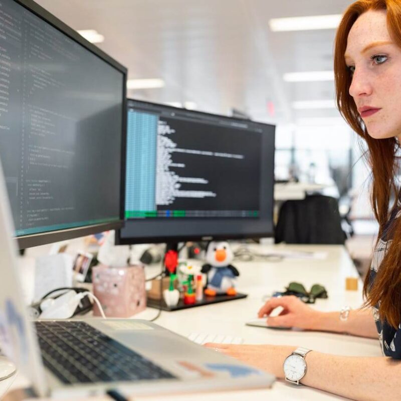 Woman behind computers